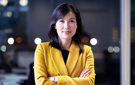 Woman standing in office at night
